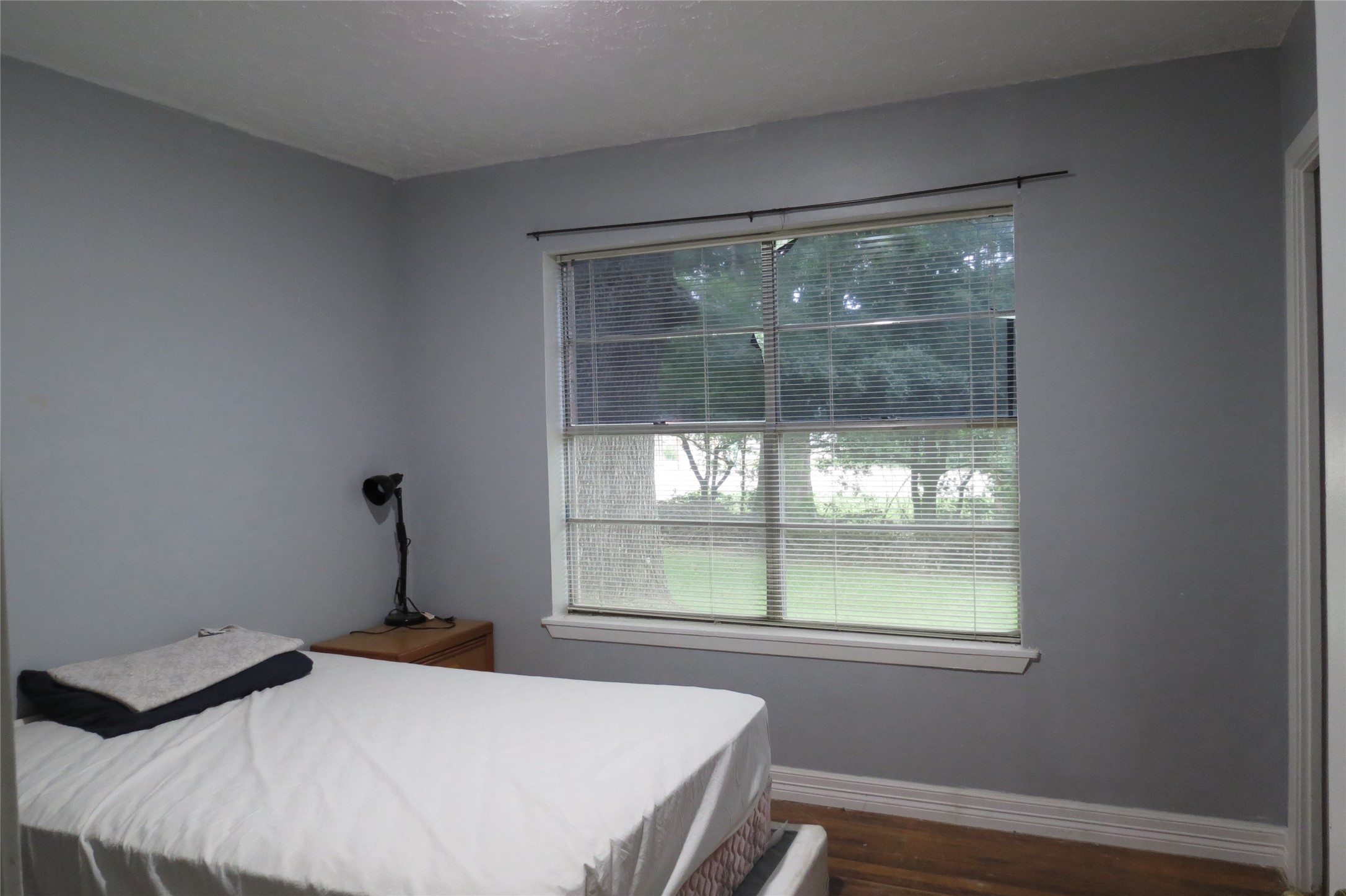 3120 Montgomery Road Huntsville, TX 77340 - Photo 14 of 16 a bedroom with a bed and a window