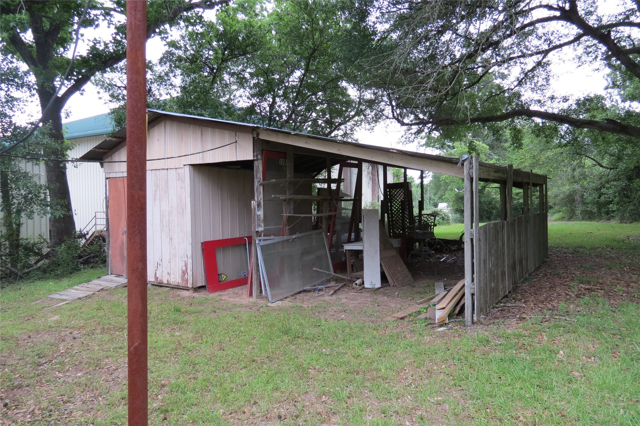 3120 Montgomery Road Huntsville, TX 77340 - Photo 7 of 16 a view of backyard with green space and trampoline