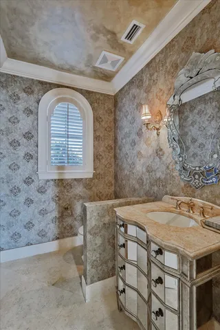 a dining room filled chandelier and wooden floor