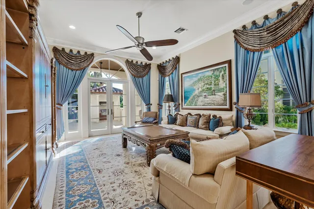 a living room with furniture windows and a rug