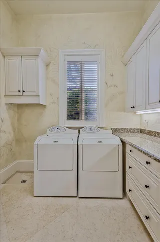 a bathroom with a granite countertop sink a mirror and a shower