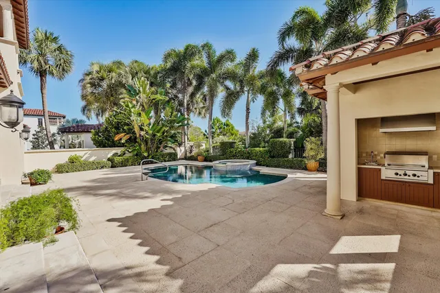 an aerial view of a houses and an outdoor space