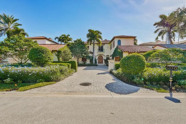 a view of a garden with a house