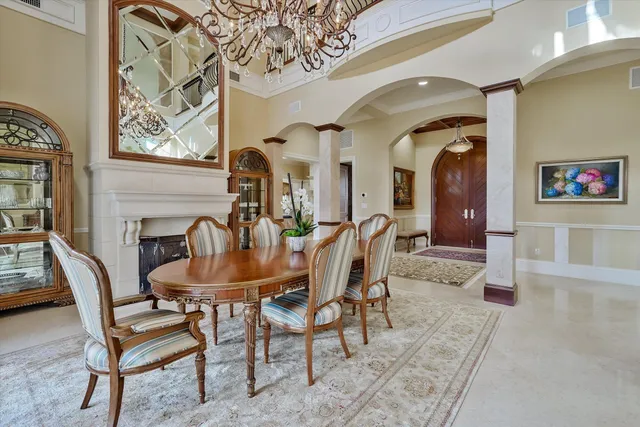 a dining room with furniture and wooden floor