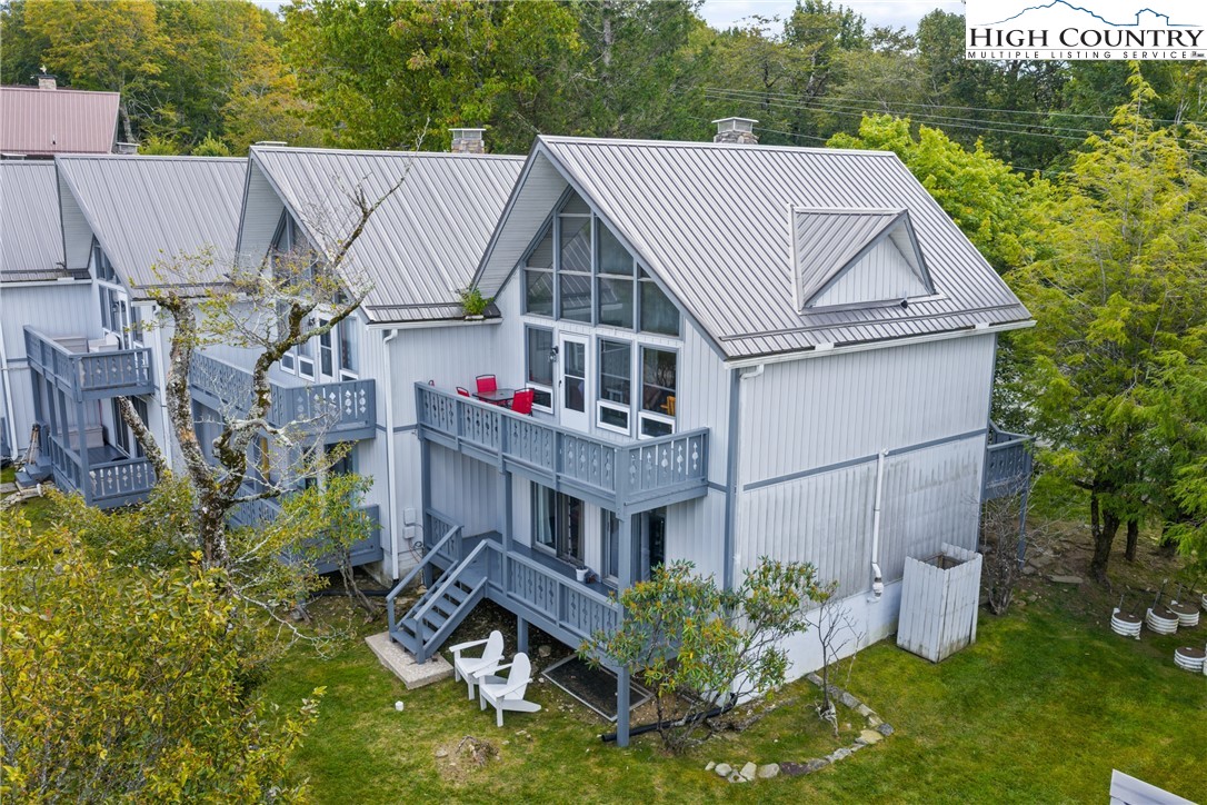 a aerial view of a house in a big yard