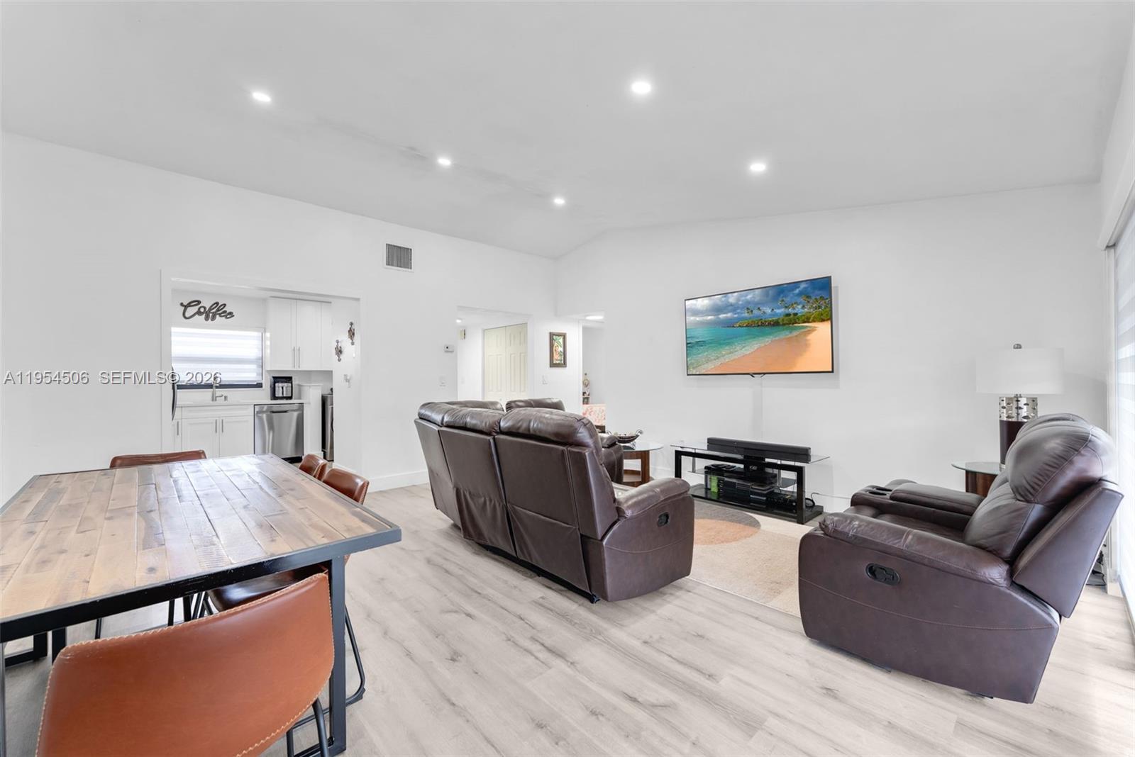 12234 Southwest 114th Terrace Miami, FL 33186 - Photo 11 of 22 a living room with furniture wooden floor and a flat screen tv
