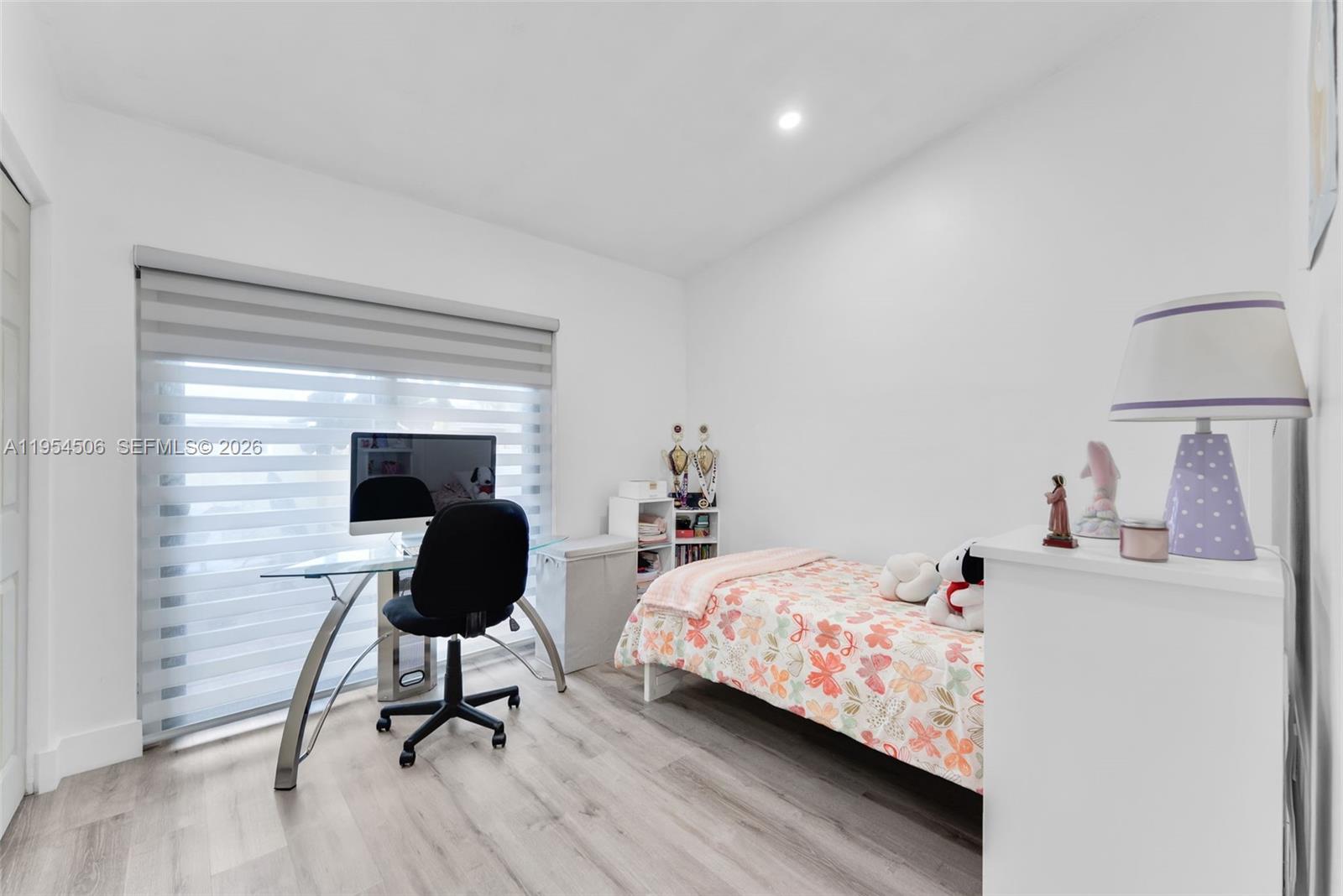 12234 Southwest 114th Terrace Miami, FL 33186 - Photo 15 of 22 a bedroom with a bed and a potted plant