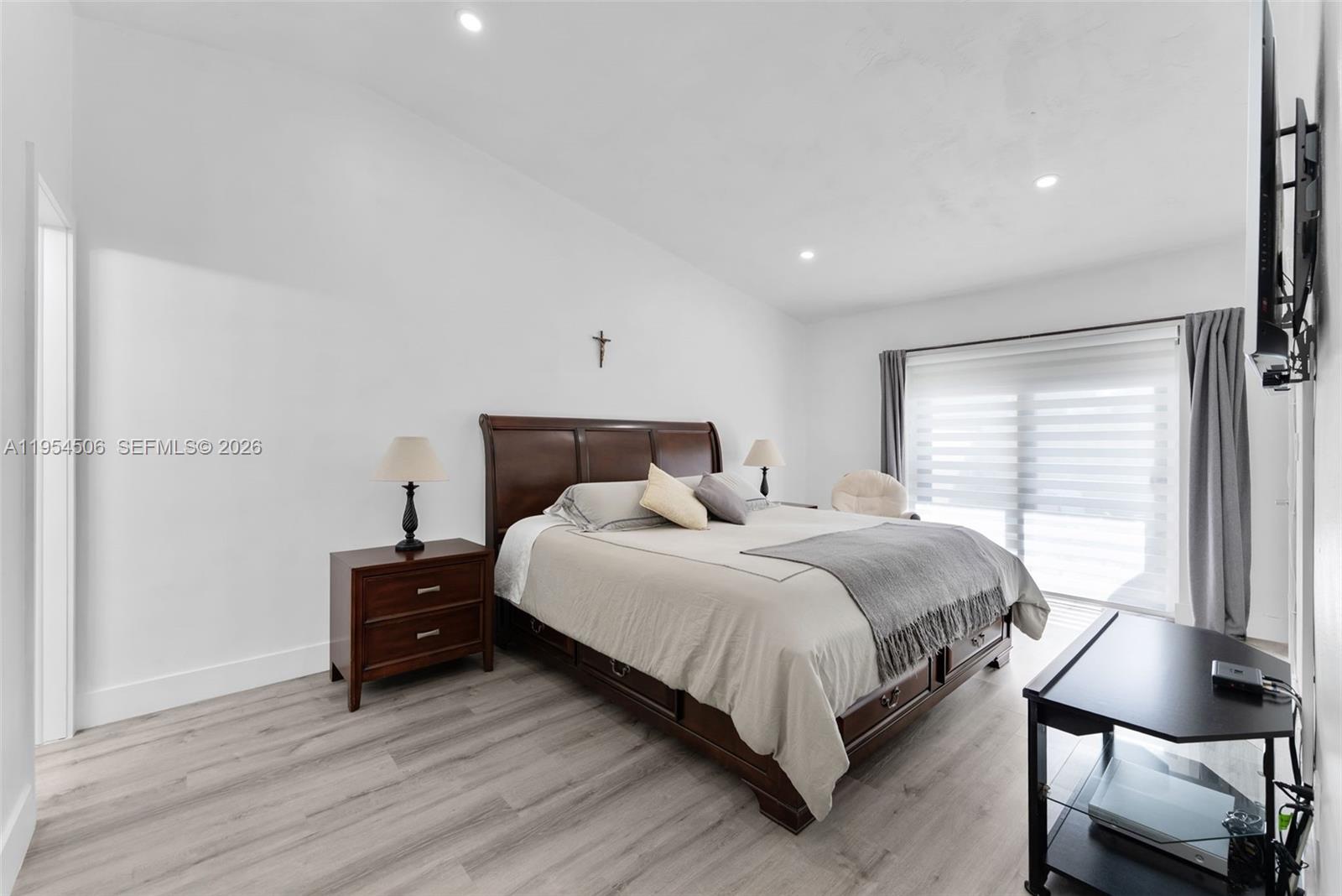 12234 Southwest 114th Terrace Miami, FL 33186 - Photo 16 of 22 a bedroom with a bed and window