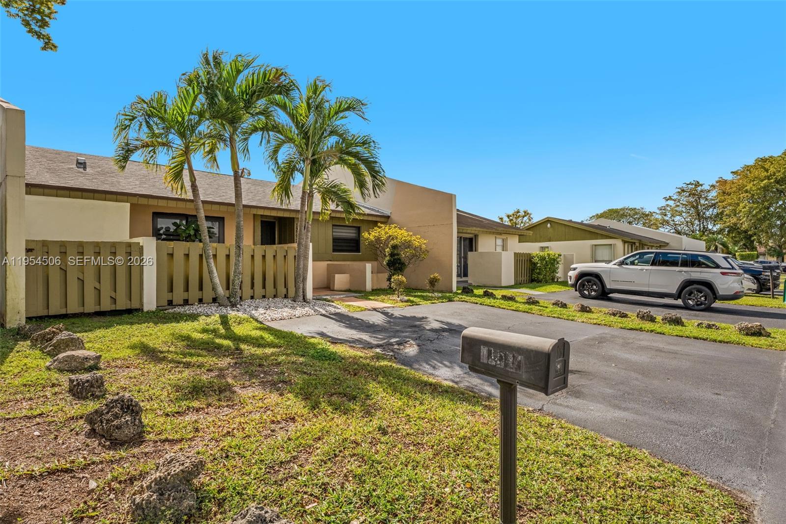 12234 Southwest 114th Terrace Miami, FL 33186 - Photo 3 of 22 a front view of a house with swimming pool