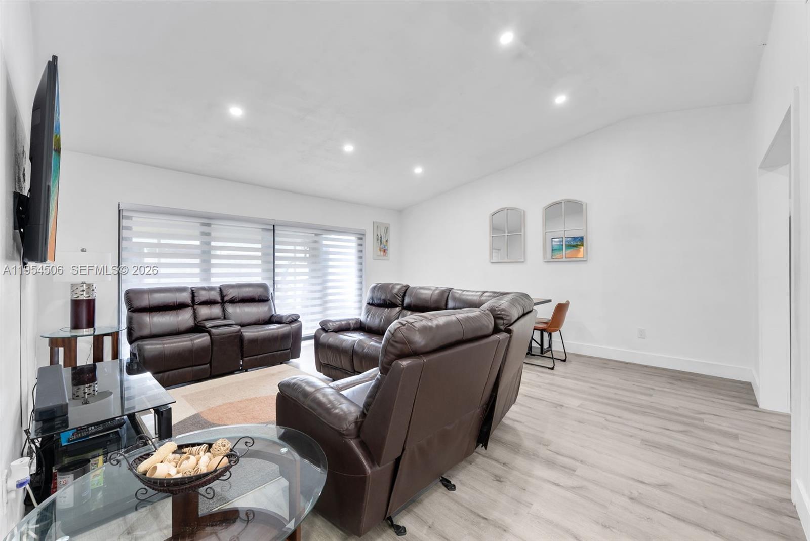 12234 Southwest 114th Terrace Miami, FL 33186 - Photo 10 of 22 a living room with furniture and a large window
