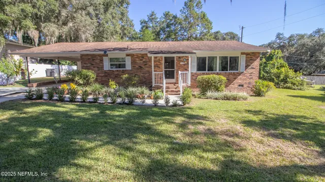 a view of swimming pool with an outdoor seating