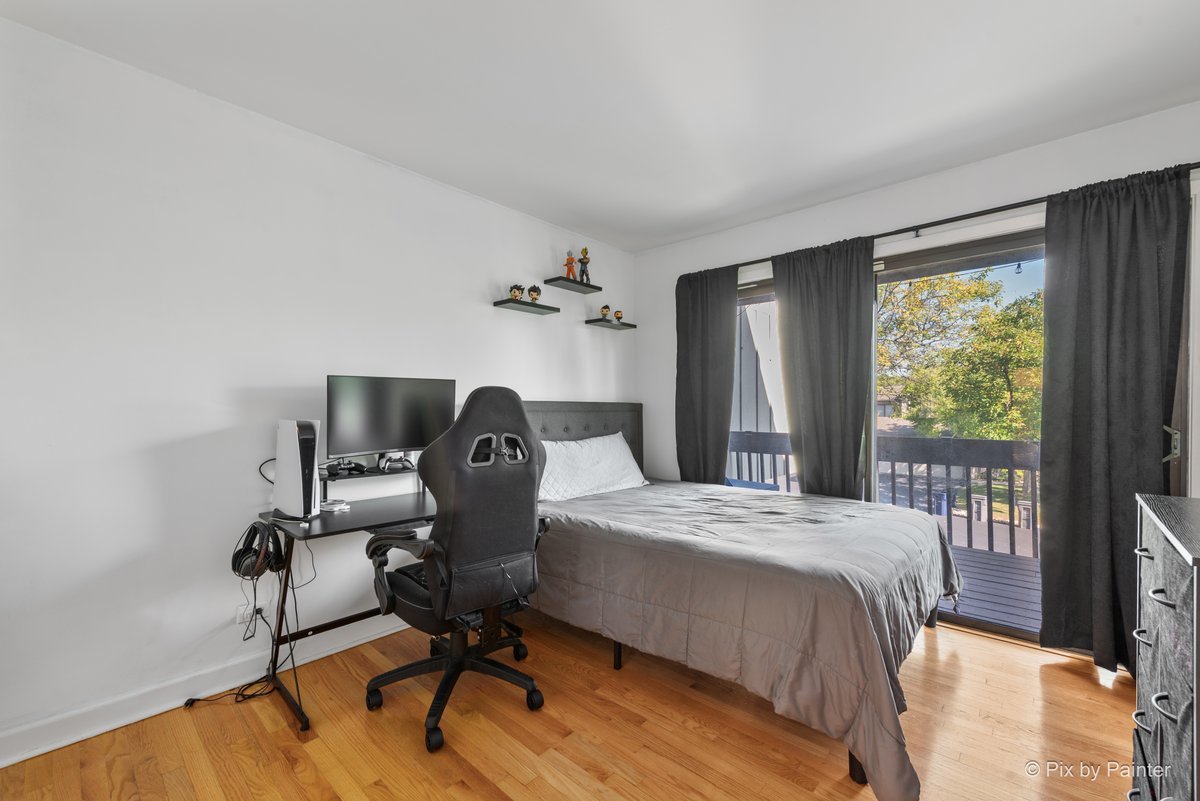 1104 Florimond Drive, Unit 1104 Elgin, IL 60123 - Photo 7 of 28 a bedroom with a bed and a window