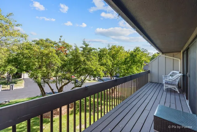 a view of balcony with wooden floor