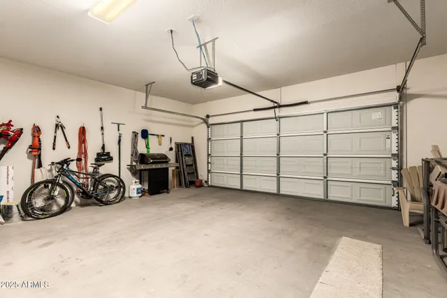 a view of a garage with rack and bicycle