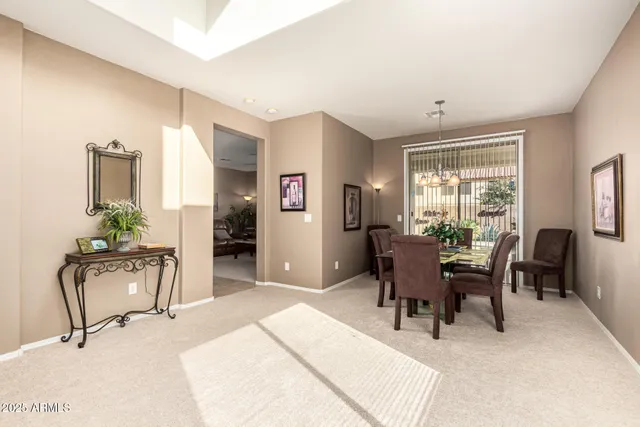 a dining room with furniture and window