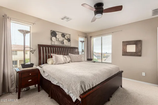 a bedroom with a bed and window