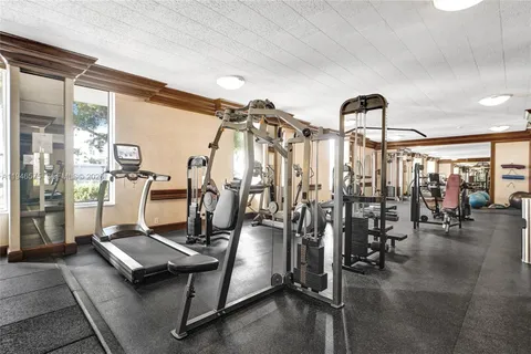 a room with lots of gym equipment