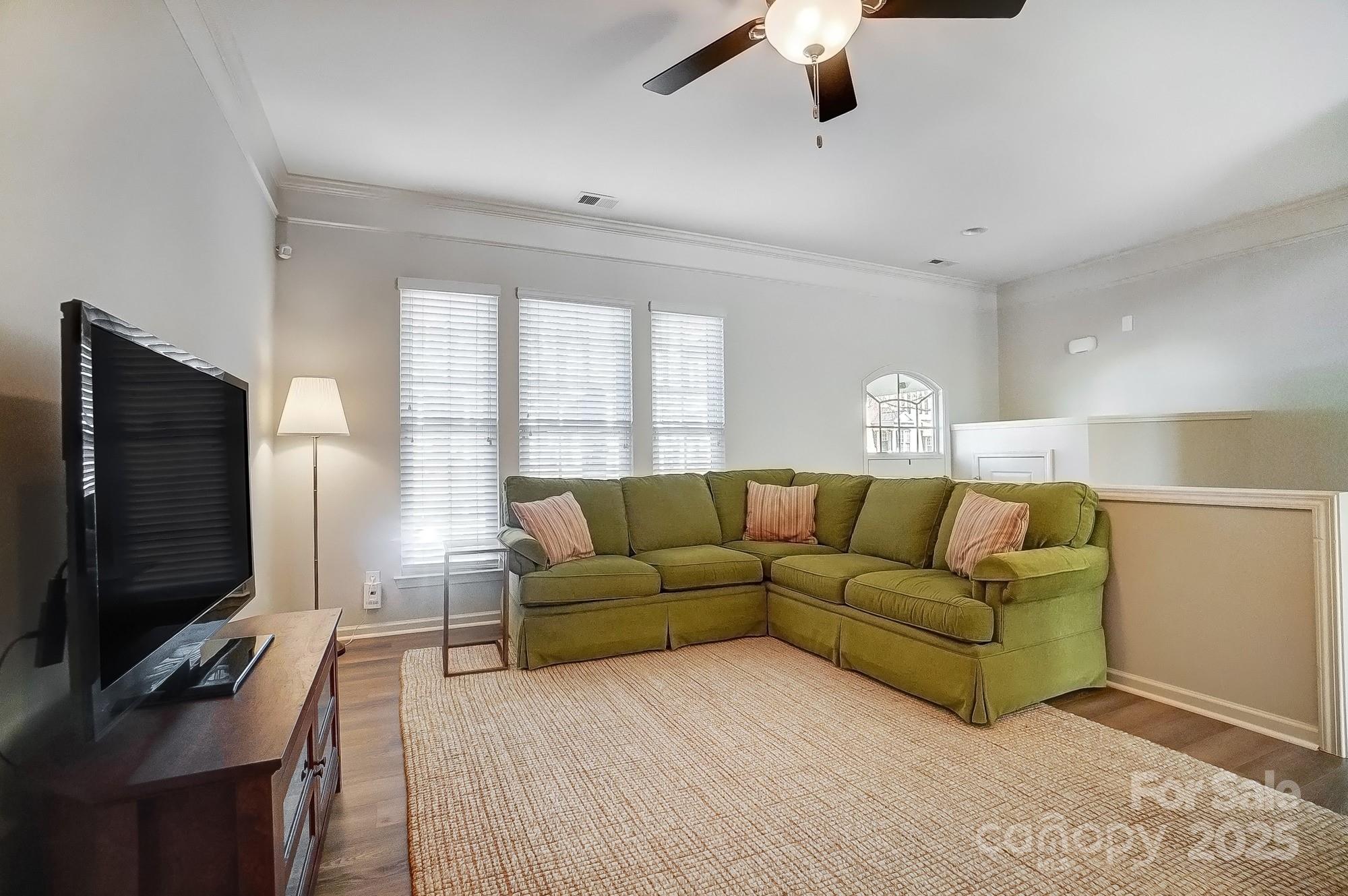 582 6th Baxter Crossing Fort Mill, SC 29708 - Photo 11 of 48 a living room with furniture and a flat screen tv