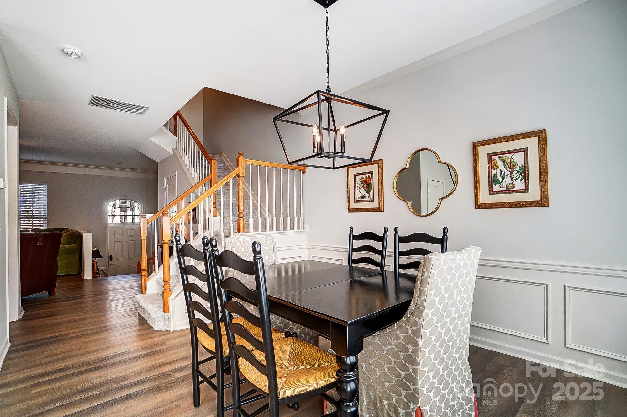 582 6th Baxter Crossing Fort Mill, SC 29708 - Photo 24 of 48 a view of a dining room with furniture and wooden floor