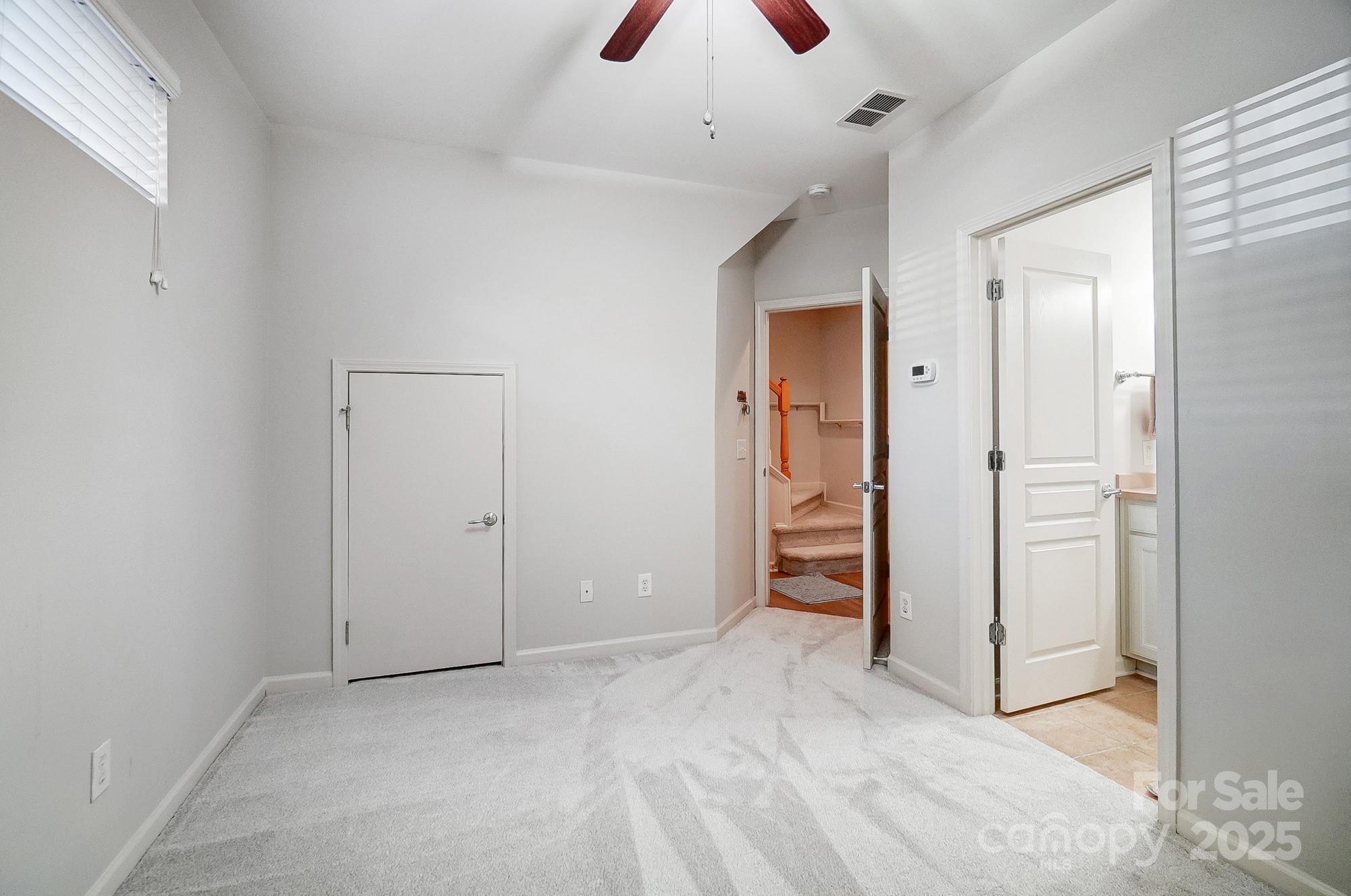 582 6th Baxter Crossing Fort Mill, SC 29708 - Photo 29 of 48 an empty room with closet and a hallway