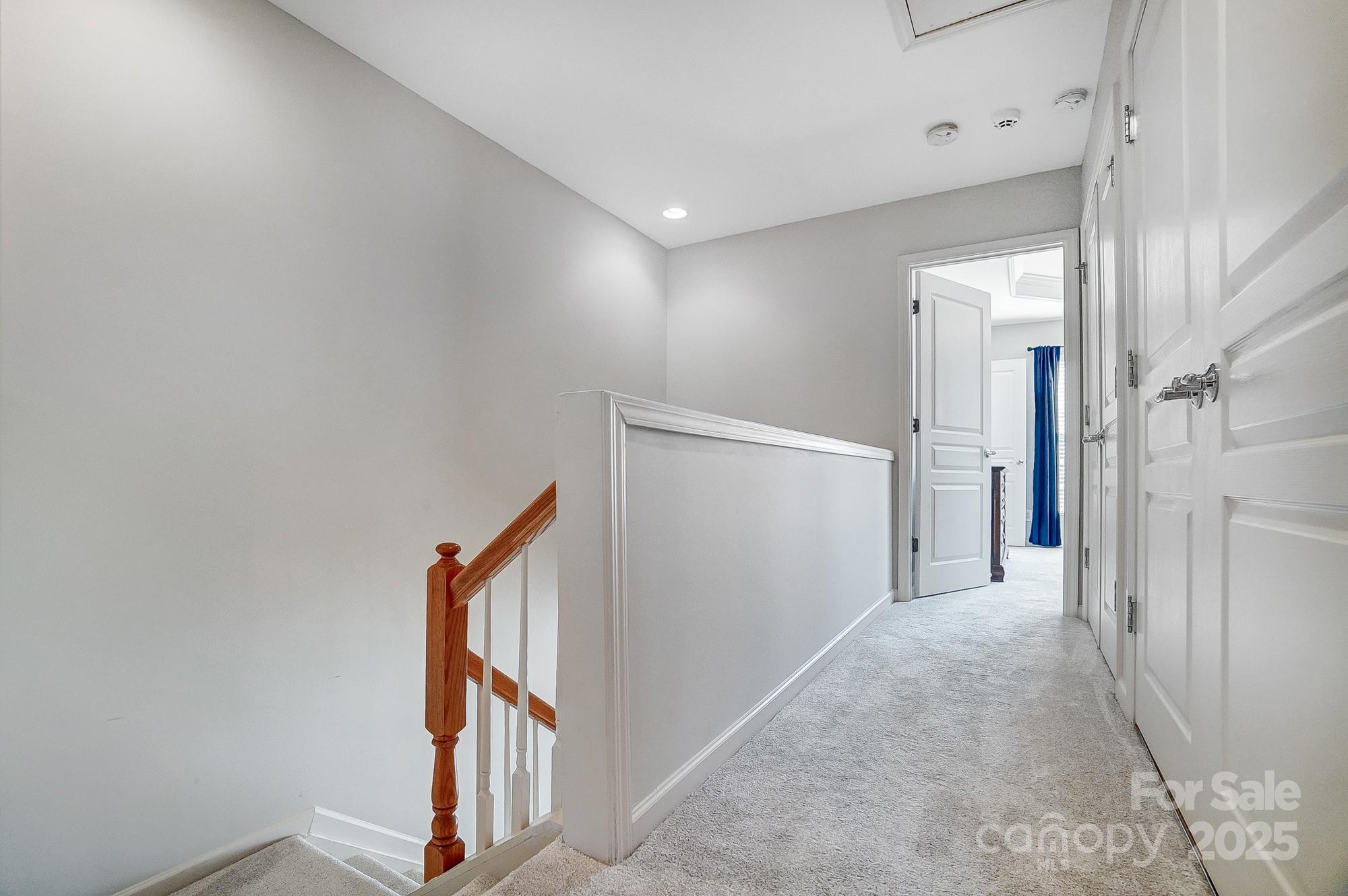582 6th Baxter Crossing Fort Mill, SC 29708 - Photo 36 of 48 a view of a hallway to rooms and stairs