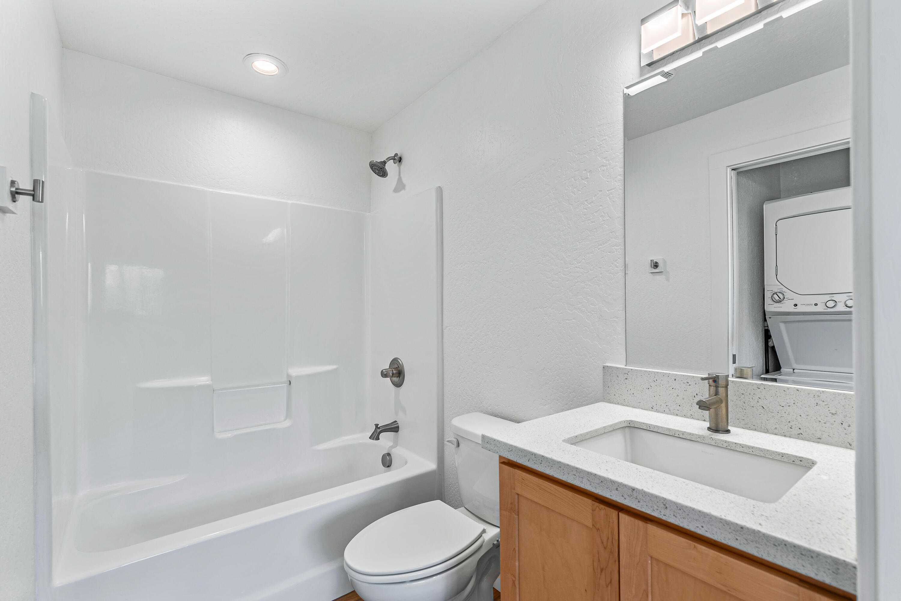 593 Crowson Road Ashland, OR 97520 - Photo 31 of 36 a bathroom with a granite countertop sink toilet and shower
