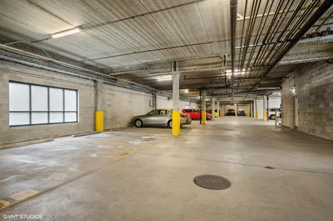 a view of parking garage with cars