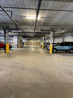 a view of parking garage with cars