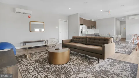 a living room with furniture and a couch