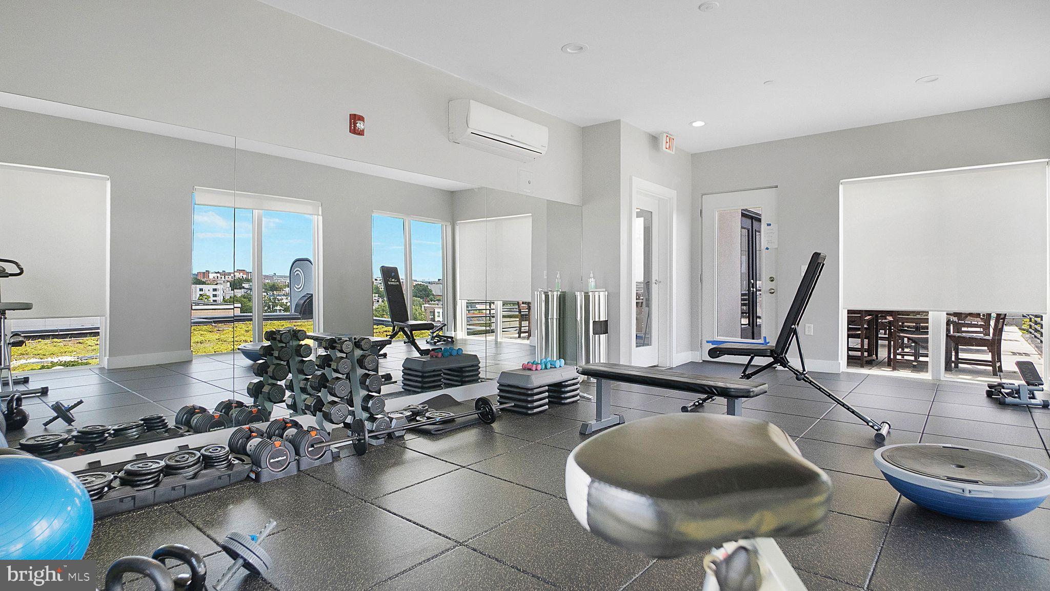 1111 Orren Street Northeast, Unit 407 Washington, DC 20002 - Photo 10 of 16 a very nice looking living room with furniture and a large window