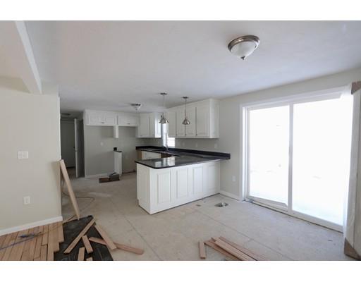 57 Leominster Road Shirley, MA 01464 - Photo 1 of 13 a kitchen with refrigerator cabinets and wooden floor