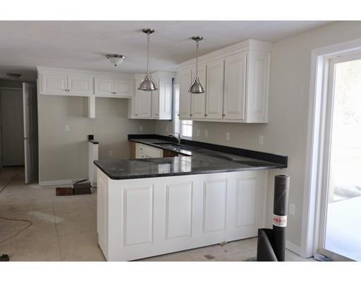 57 Leominster Road Shirley, MA 01464 - Photo 13 of 13 a kitchen with granite countertop a sink stainless steel appliances and cabinets