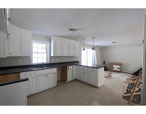 57 Leominster Road Shirley, MA 01464 - Photo 2 of 13 a kitchen with a sink window and cabinets