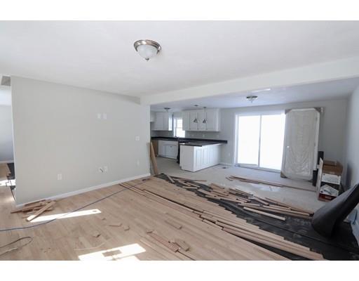 57 Leominster Road Shirley, MA 01464 - Photo 3 of 13 a living room with kitchen furniture and a table