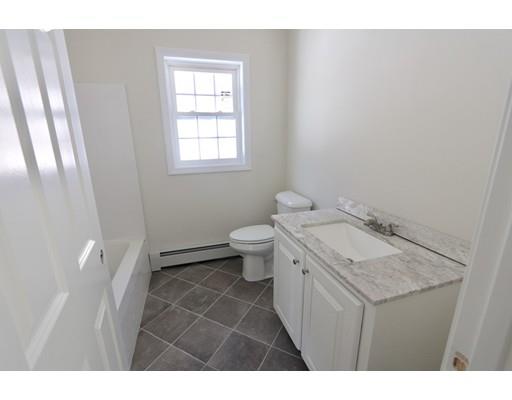 57 Leominster Road Shirley, MA 01464 - Photo 7 of 13 a bathroom with a granite countertop sink toilet and a window