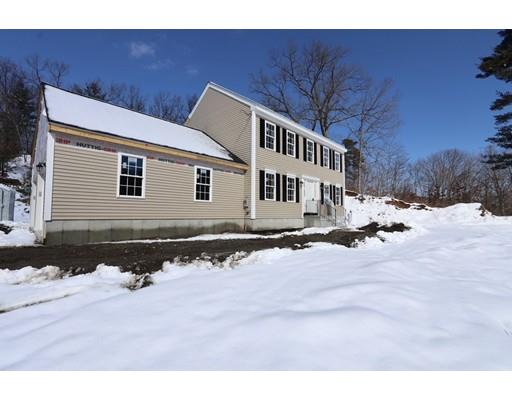 57 Leominster Road Shirley, MA 01464 - Photo 8 of 13 a front view of a house with a yard covered in snow