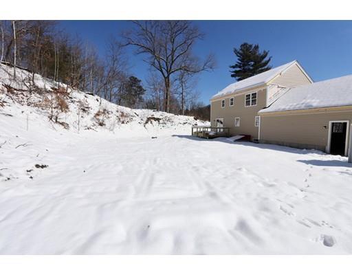57 Leominster Road Shirley, MA 01464 - Photo 10 of 13 a view of a white house with a snow