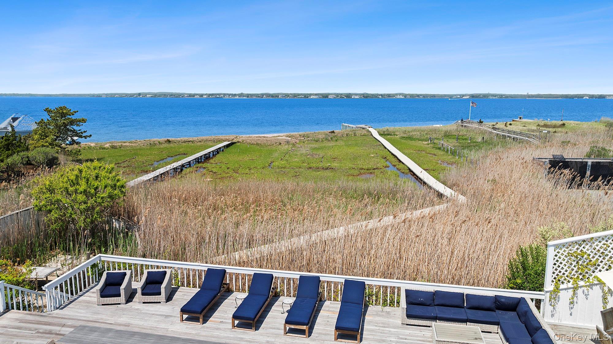 588 Dune Road Westhampton, NY 11978 - Photo 11 of 23 a view of a balcony with mountain view