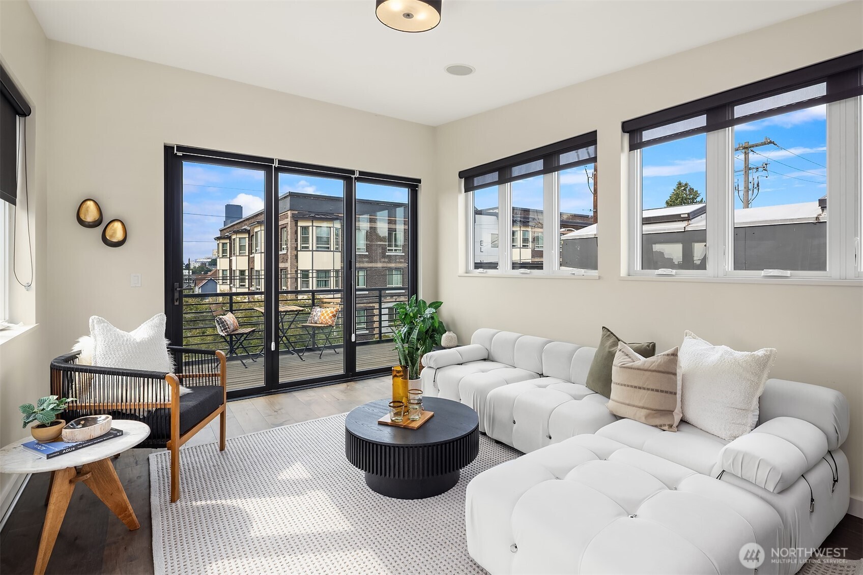 112 18th Avenue Seattle, WA 98122 - Photo 18 of 30 a living room with furniture and a floor to ceiling window