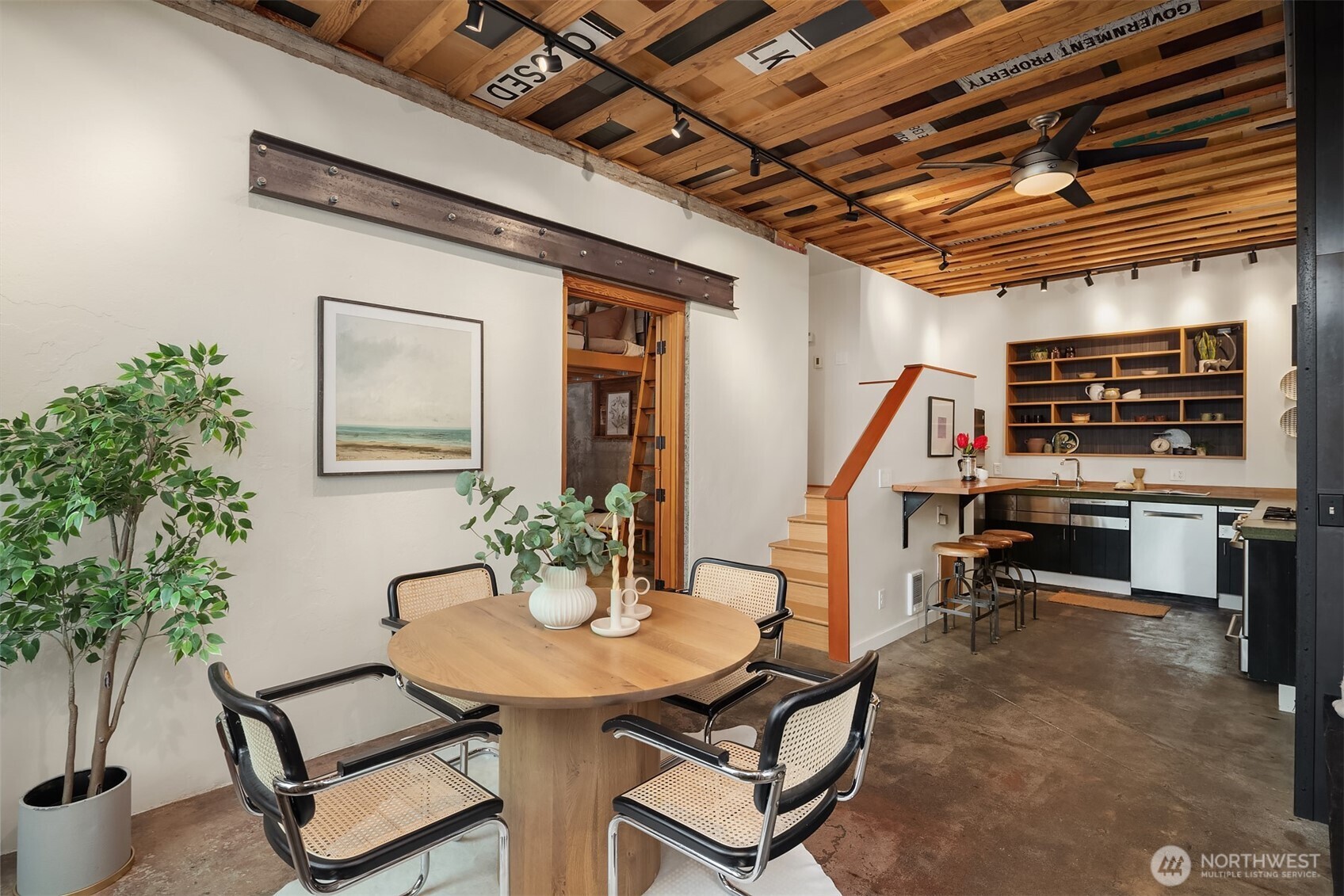 112 18th Avenue Seattle, WA 98122 - Photo 2 of 30 a dining room with furniture and a potted plant