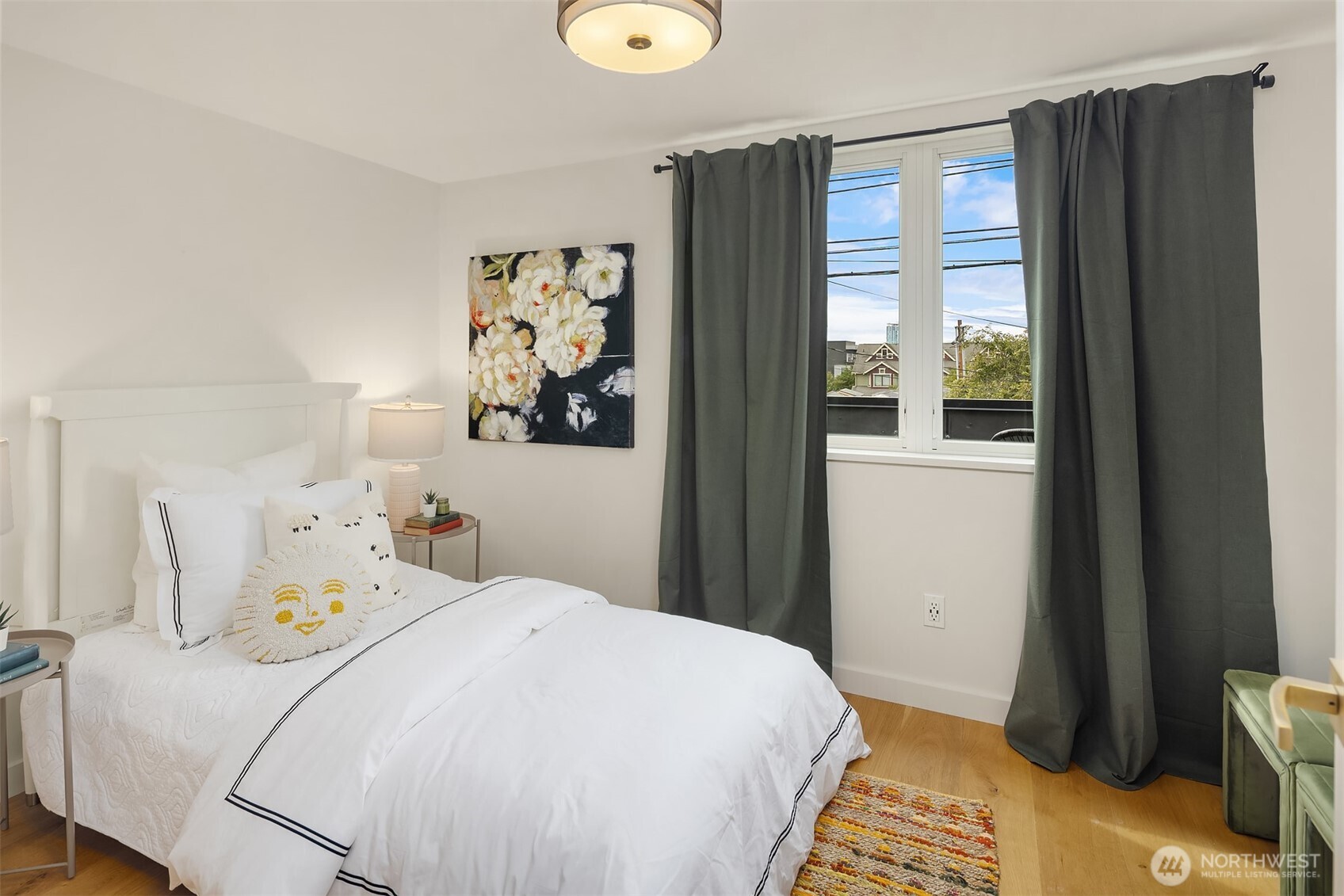 112 18th Avenue Seattle, WA 98122 - Photo 21 of 30 a bedroom with a bed and a window