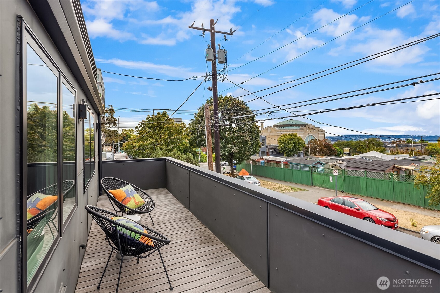 112 18th Avenue Seattle, WA 98122 - Photo 23 of 30 a balcony with wooden floor and outdoor seating