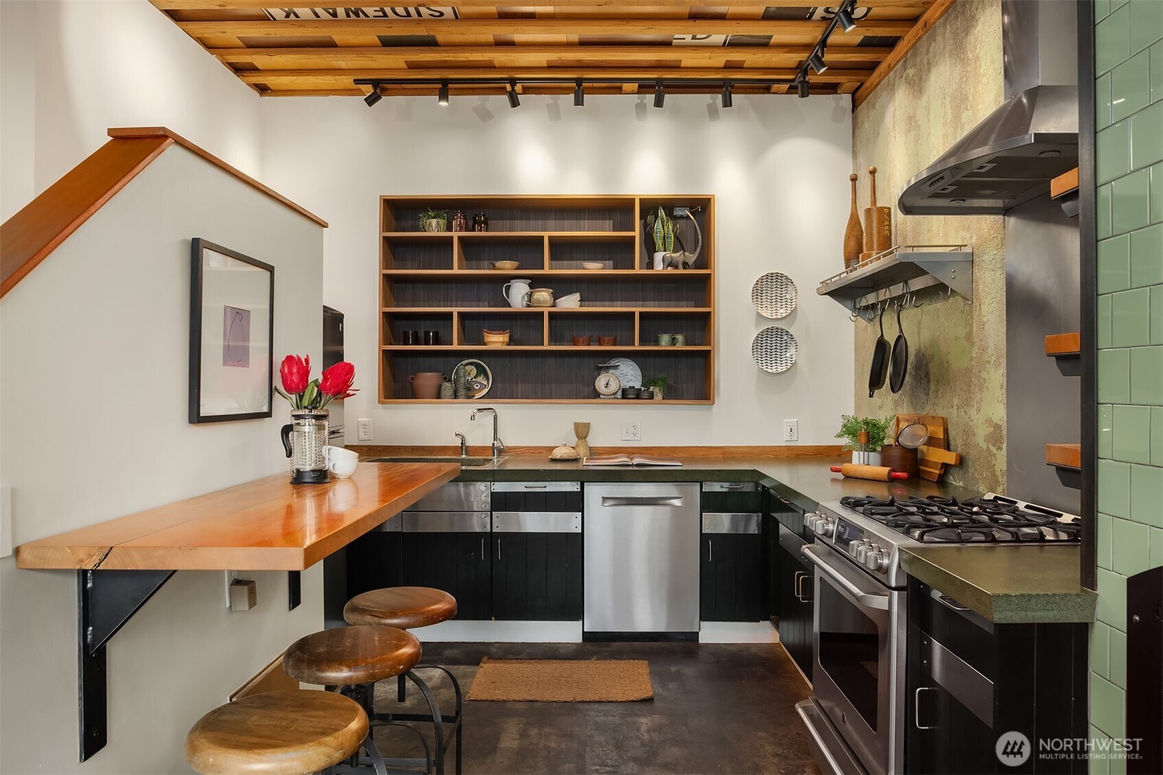 112 18th Avenue Seattle, WA 98122 - Photo 6 of 30 a kitchen with stainless steel appliances granite countertop a sink and cabinets