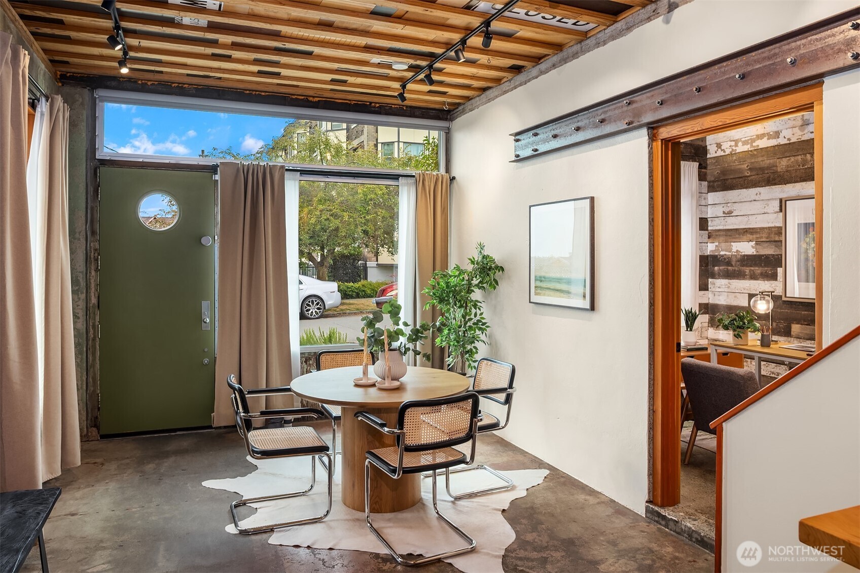 112 18th Avenue Seattle, WA 98122 - Photo 8 of 30 a view of an outdoor dining space with a table and chairs