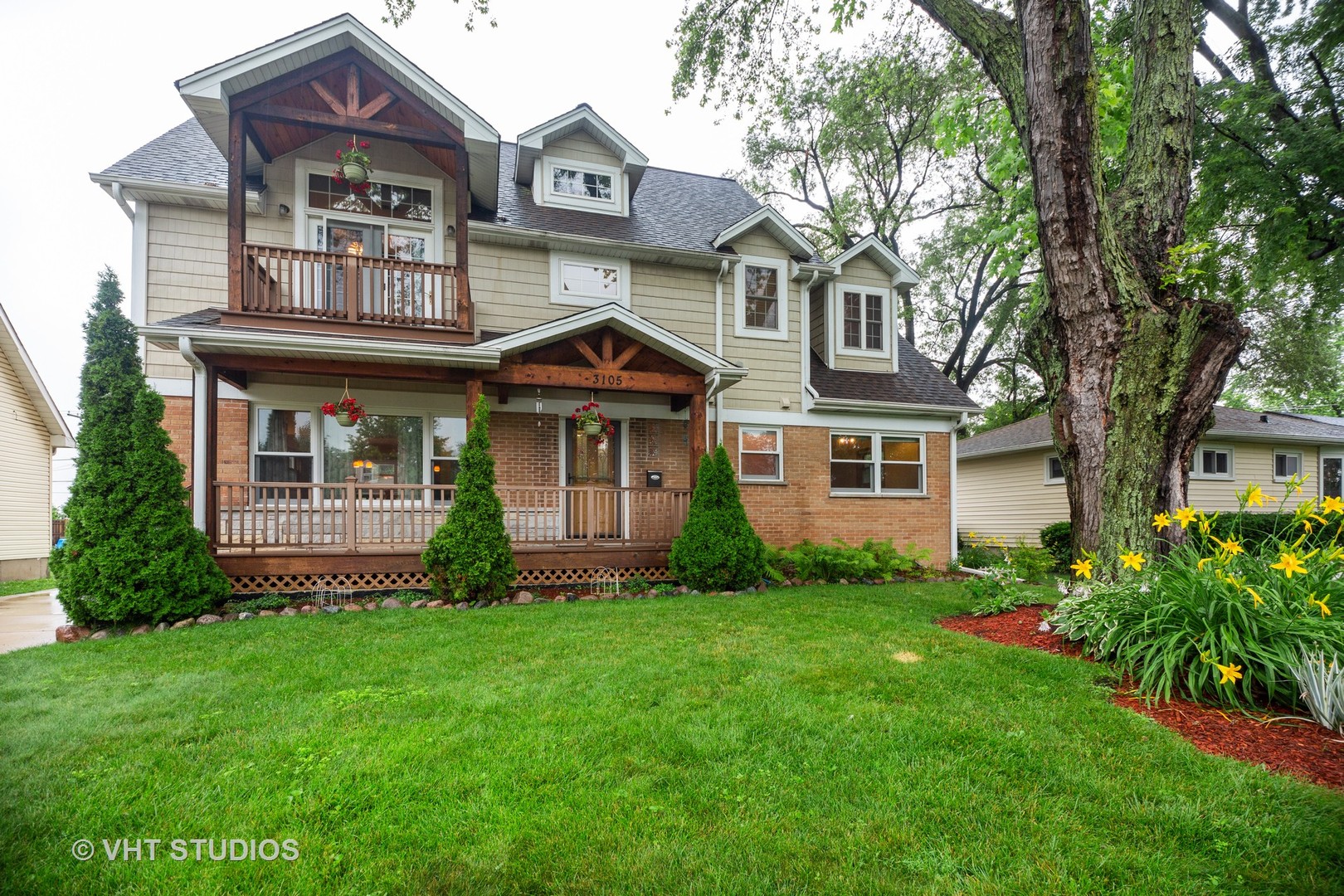 a front view of a house with a garden