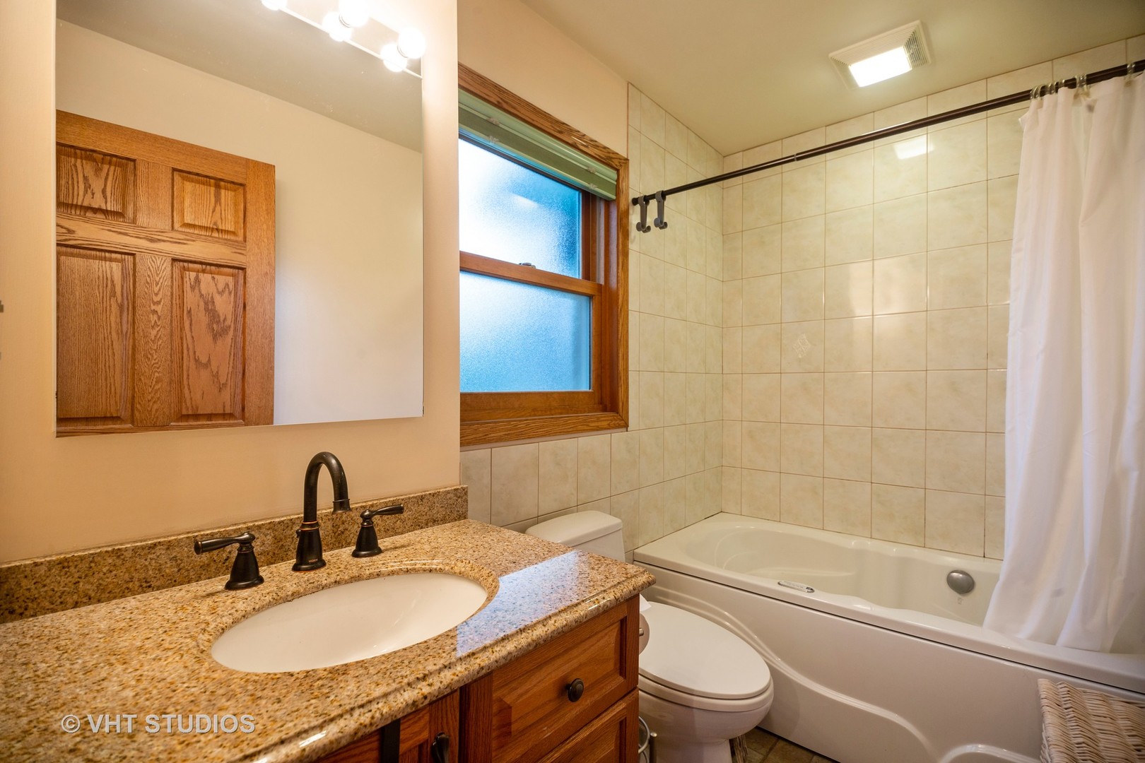 3105 Patton Drive Des Plaines, IL 60018 - Photo 13 of 27 a bathroom with a granite countertop sink a toilet and shower