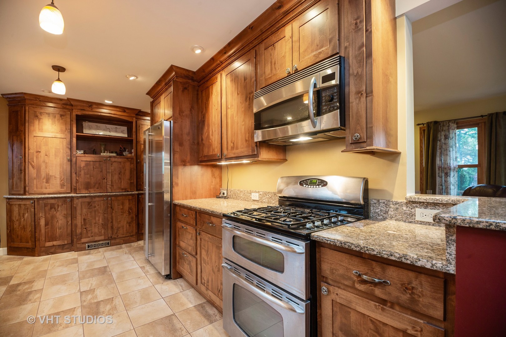 3105 Patton Drive Des Plaines, IL 60018 - Photo 7 of 27 a kitchen with stainless steel appliances granite countertop a stove a sink and a microwave