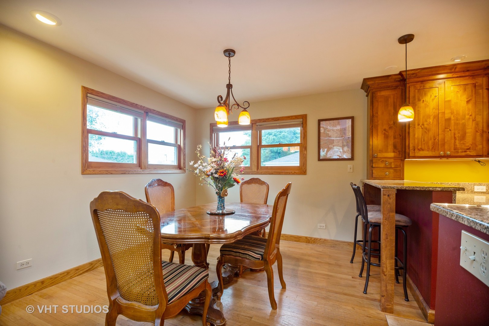 3105 Patton Drive Des Plaines, IL 60018 - Photo 10 of 27 a dining room with furniture a chandelier and wooden floor