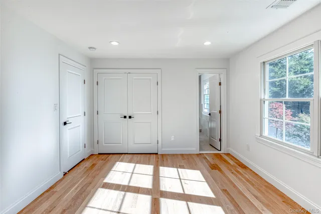 a view of empty room with window and entryway