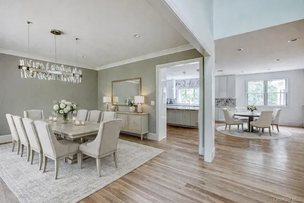 a dining room with furniture and wooden floor